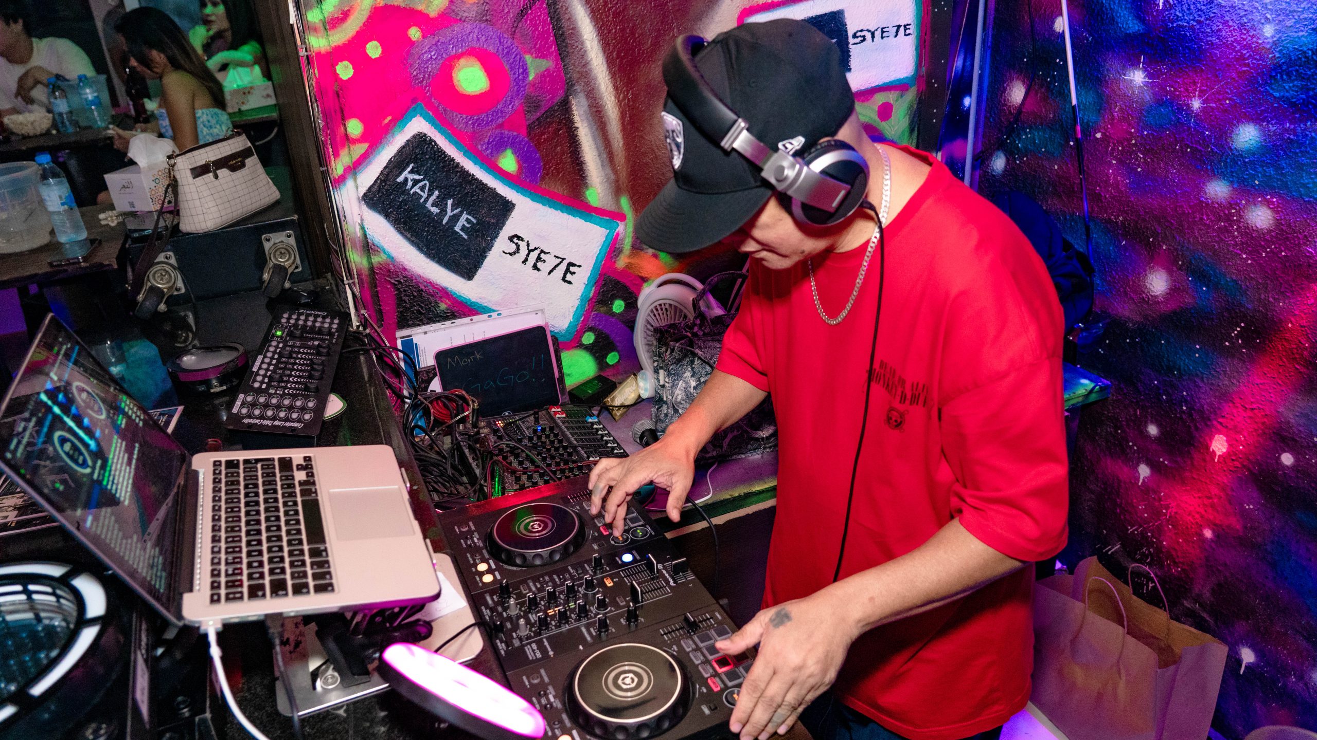 DJ mixing music at Kalye Syete bar
